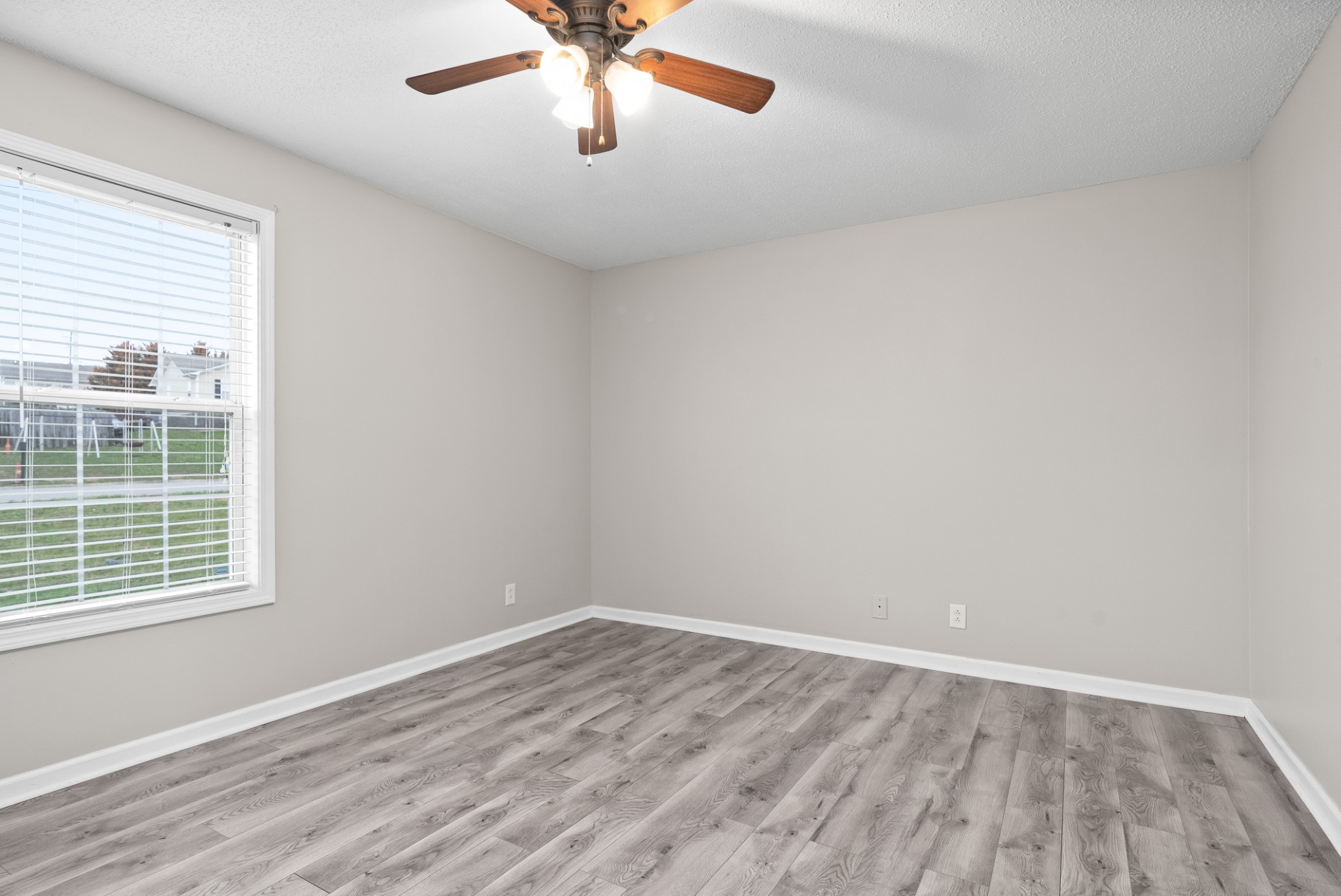 103 Meridians Way Oak Grove, KY 42262 - Photo 15 of 32 wooden floor in an empty room with a window