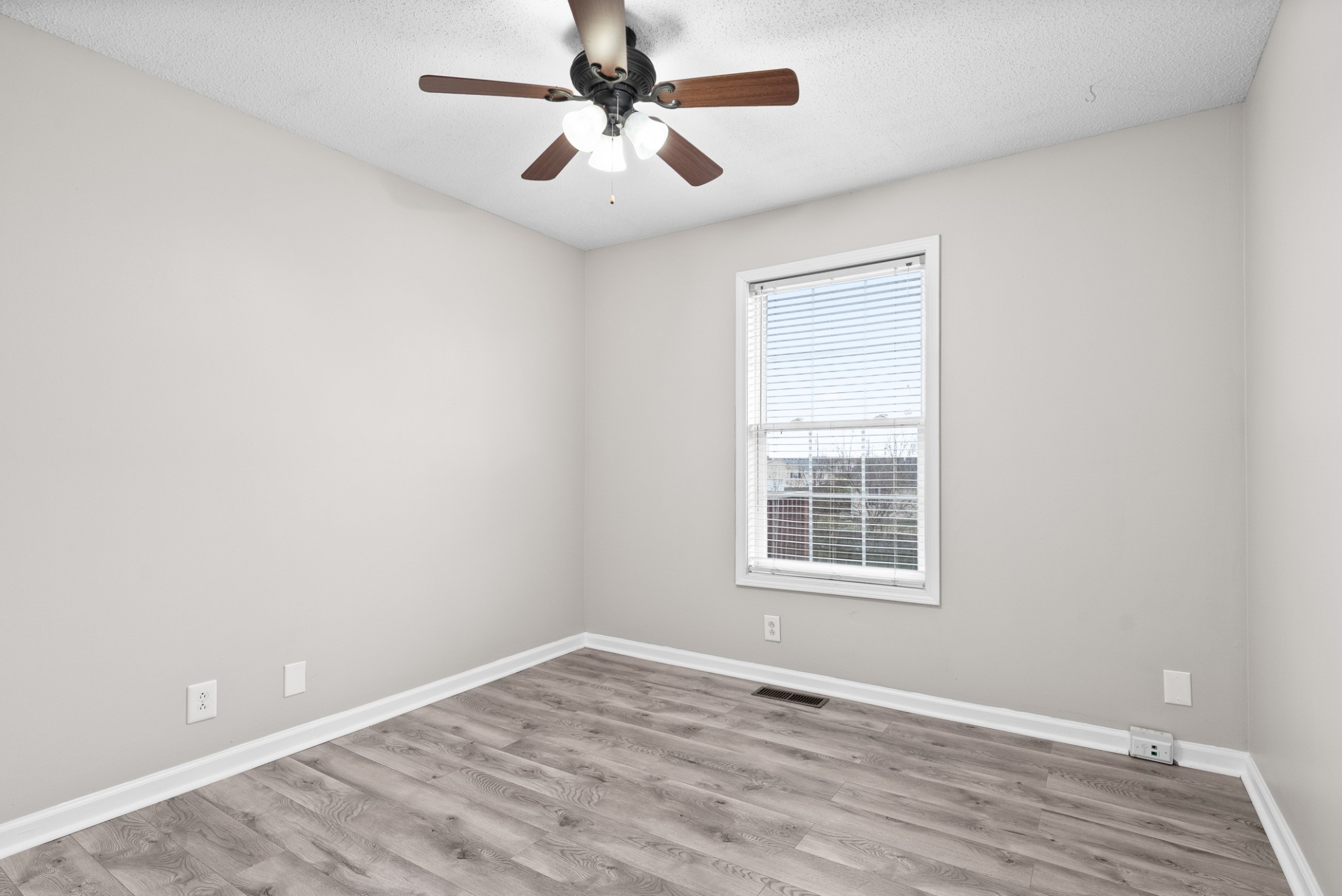 103 Meridians Way Oak Grove, KY 42262 - Photo 20 of 32 an empty room with a window and a ceiling fan