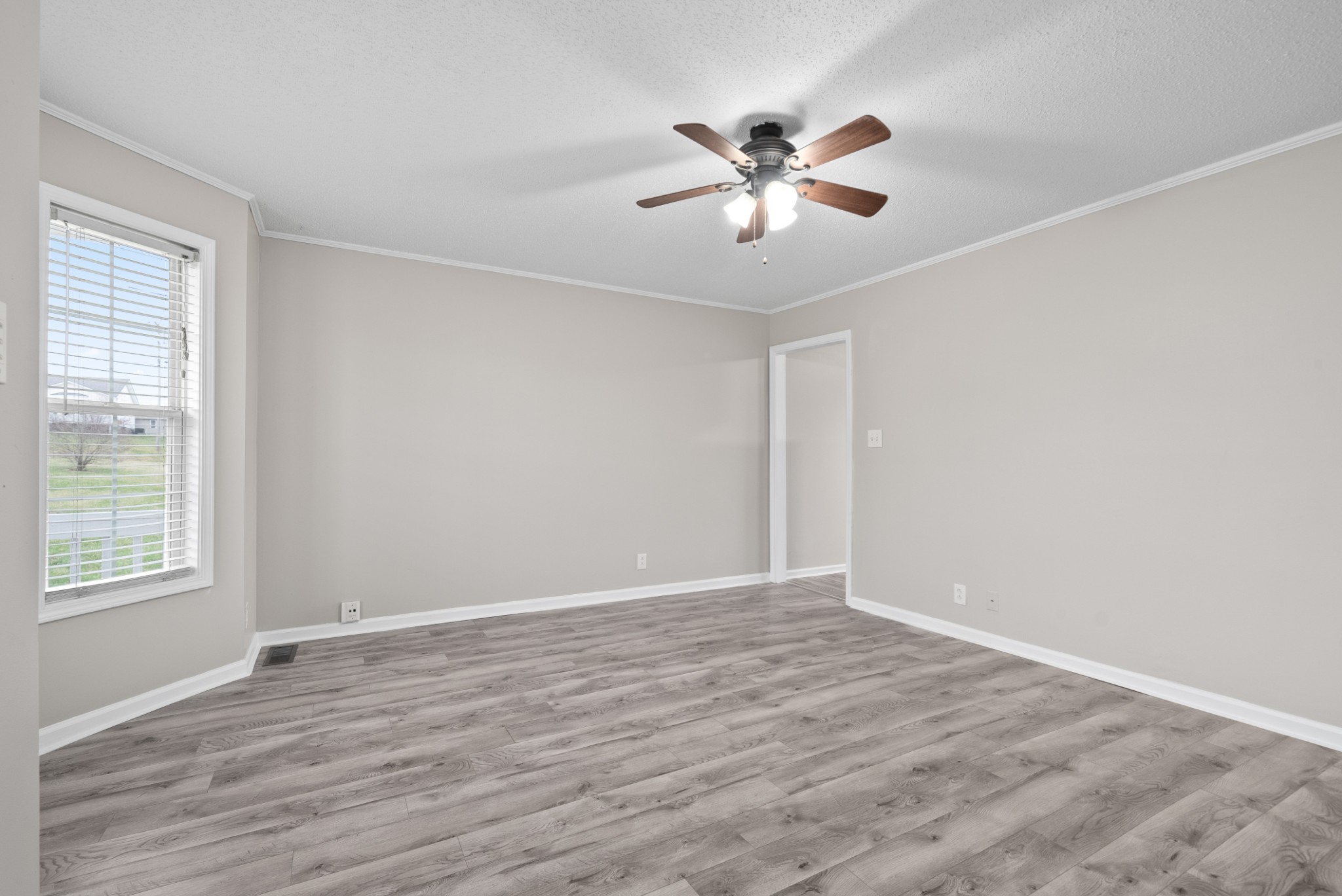 103 Meridians Way Oak Grove, KY 42262 - Photo 23 of 32 a view of an empty room with wooden floor and a window