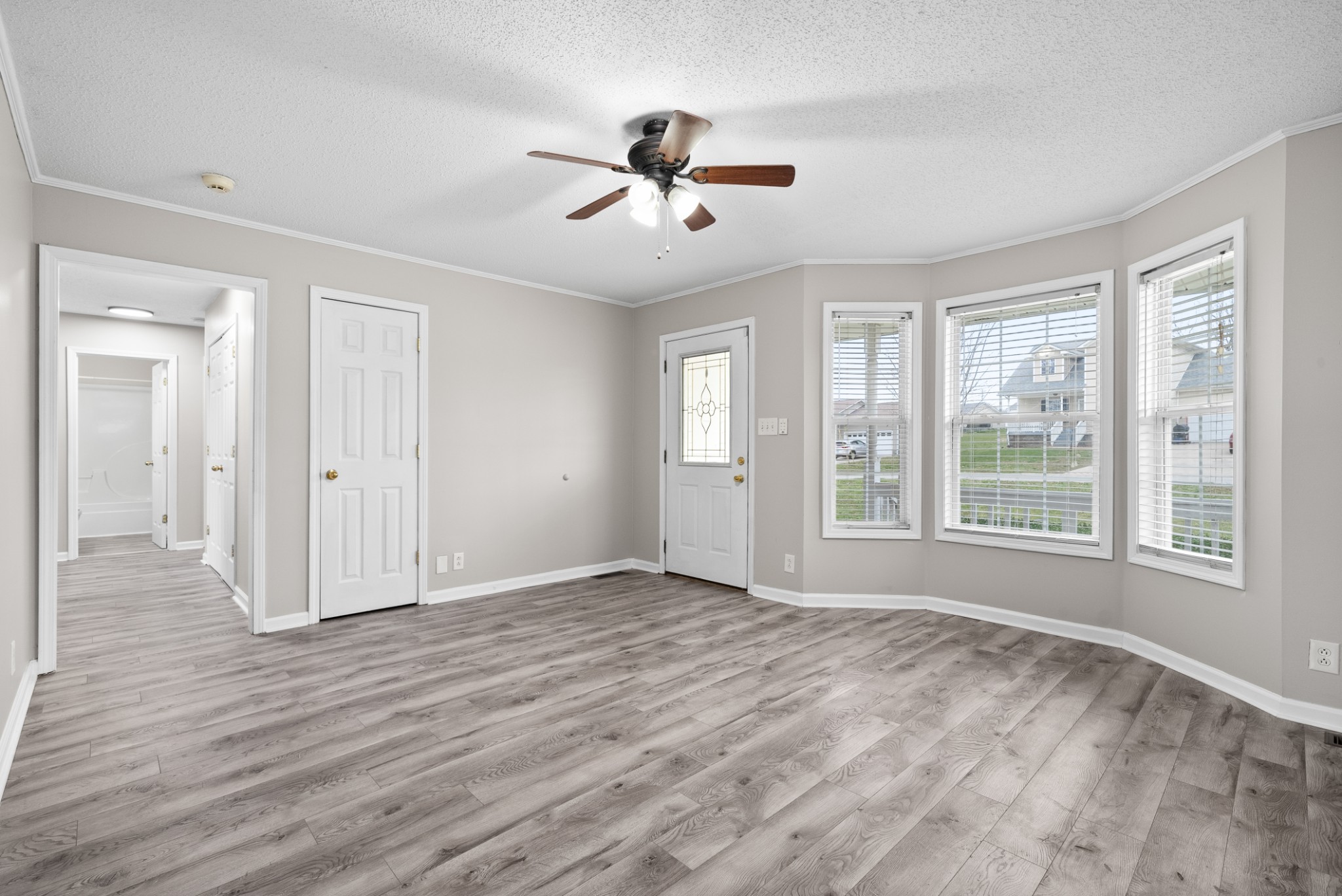 103 Meridians Way Oak Grove, KY 42262 - Photo 6 of 32 a view of an empty room with wooden floor and a window