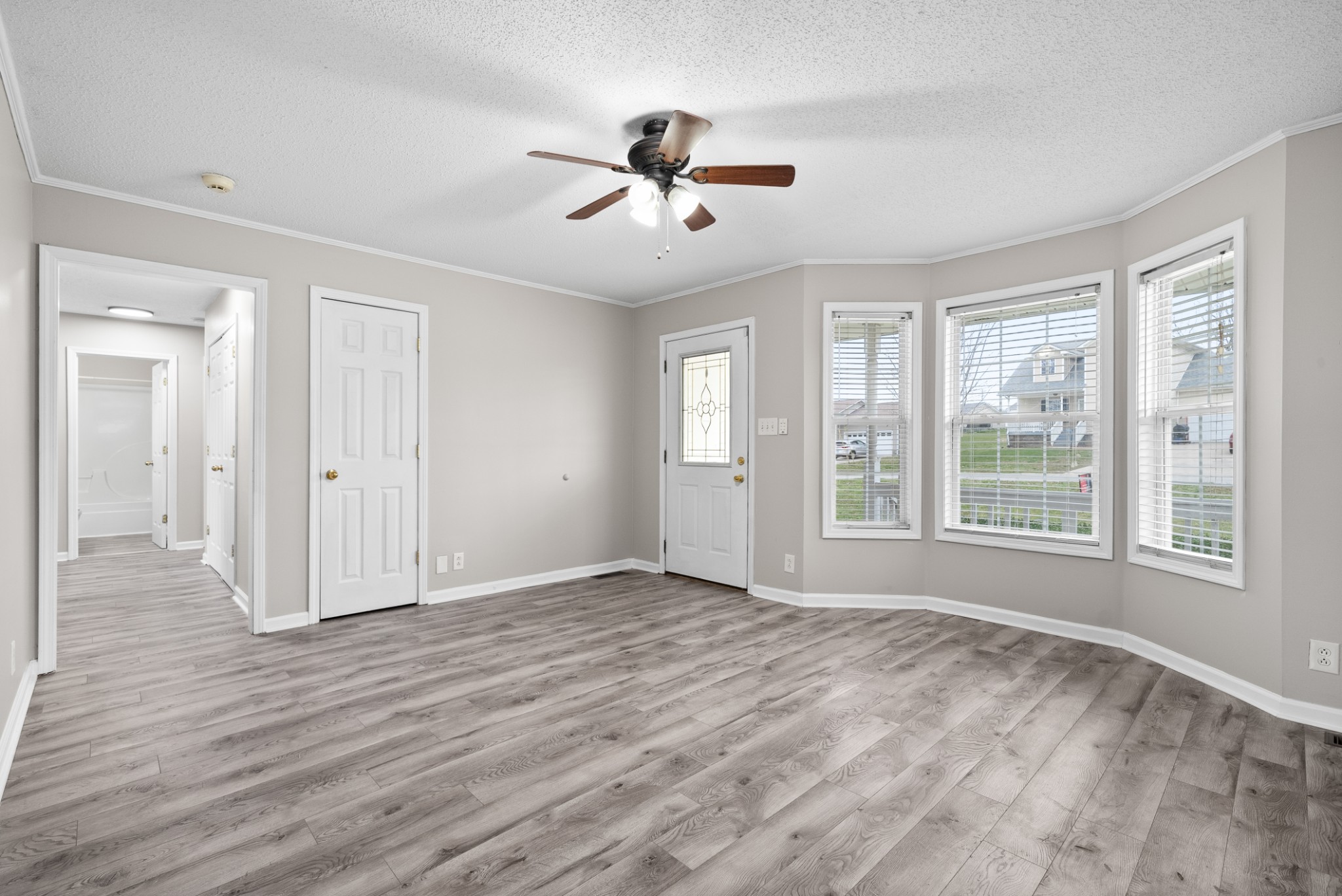 103 Meridians Way Oak Grove, KY 42262 - Photo 7 of 32 a view of an empty room with wooden floor and a window