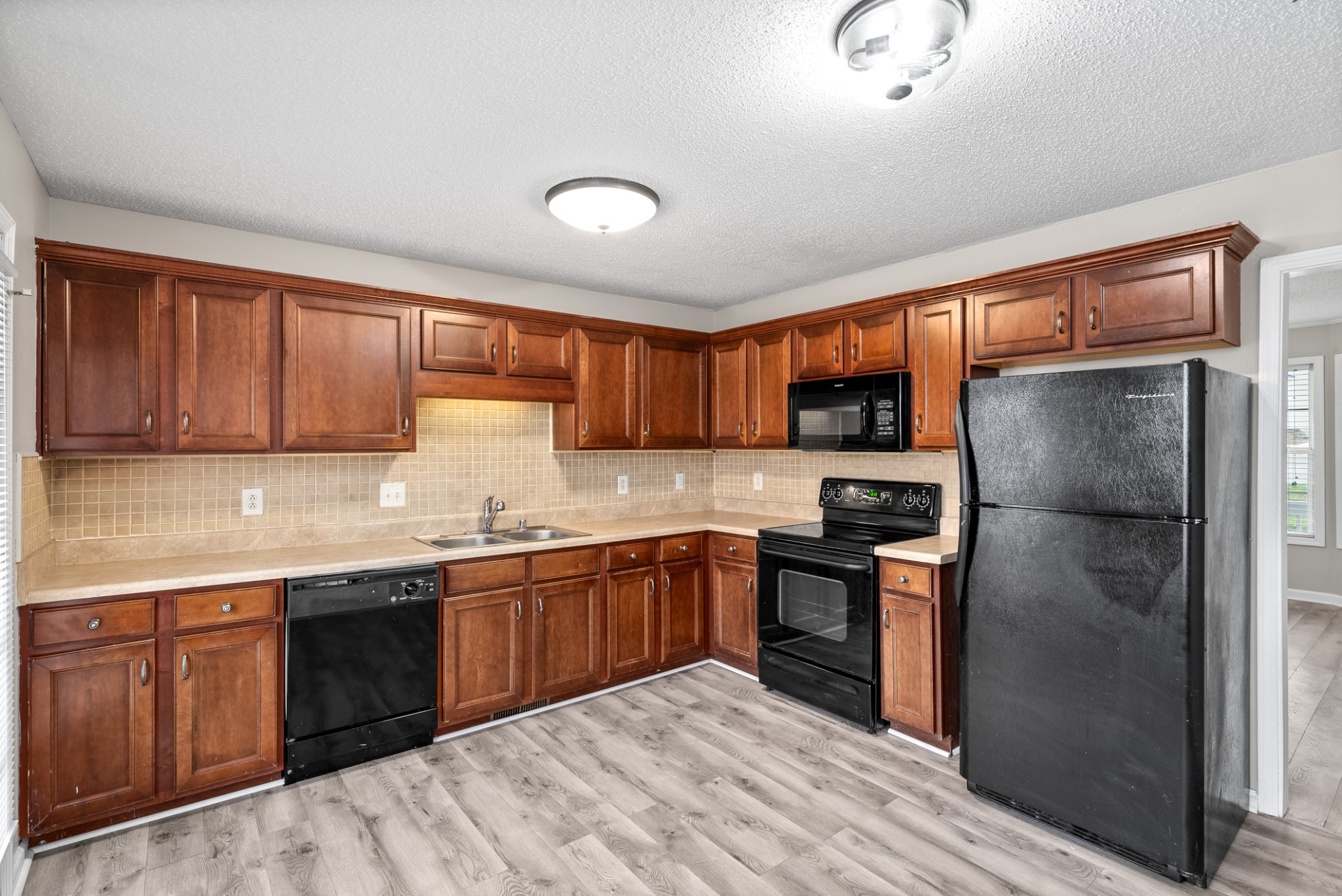 103 Meridians Way Oak Grove, KY 42262 - Photo 10 of 32 a kitchen with stainless steel appliances granite countertop a refrigerator stove top oven a sink and dishwasher