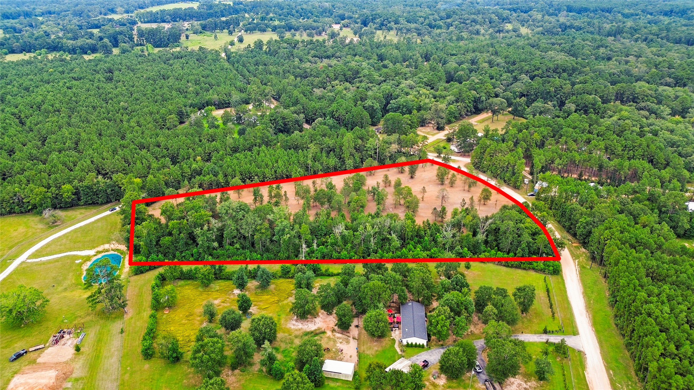 Tbd Big Woods Road New Waverly, TX 77358 - Photo 2 of 11 a view of a garden with flowers