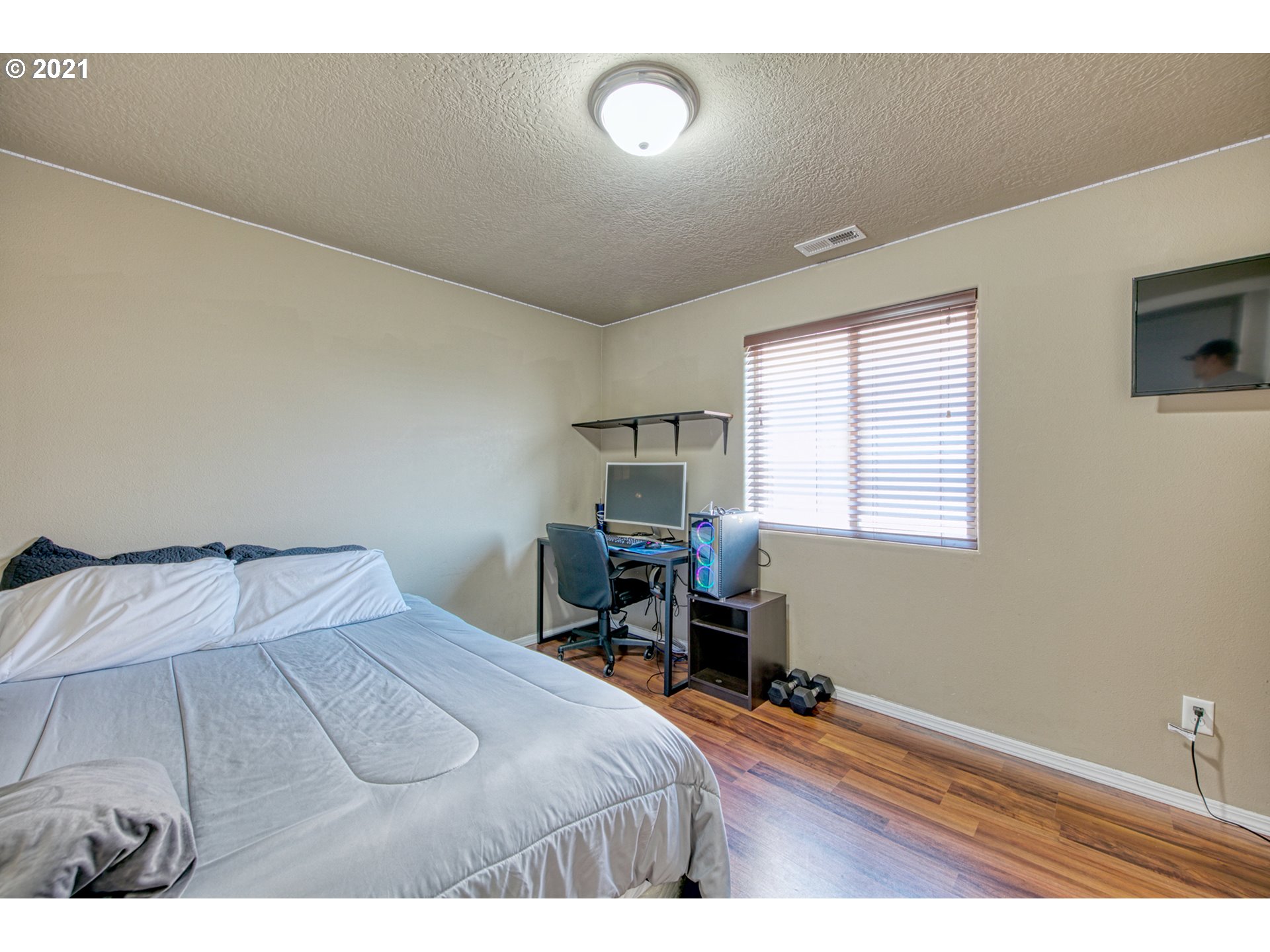 1962 Adelman Loop Eugene, OR 97402 - Photo 13 of 22 a bedroom with a bed and a table