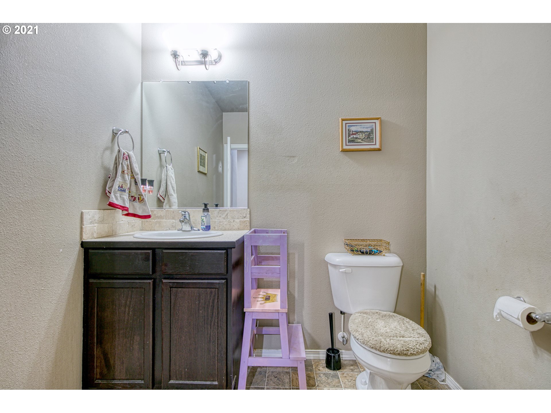 1962 Adelman Loop Eugene, OR 97402 - Photo 9 of 22 a bathroom with a sink a toilet and mirror