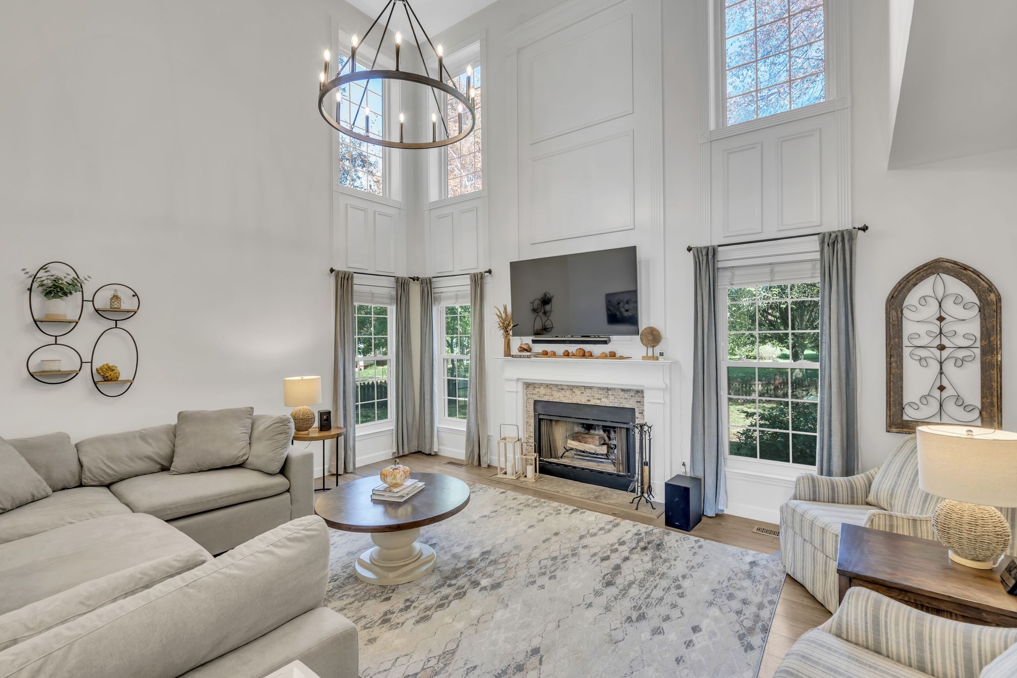 601 Rutherford Lane Franklin, TN 37064 - Photo 19 of 54 a living room with furniture a fireplace and a flat screen tv