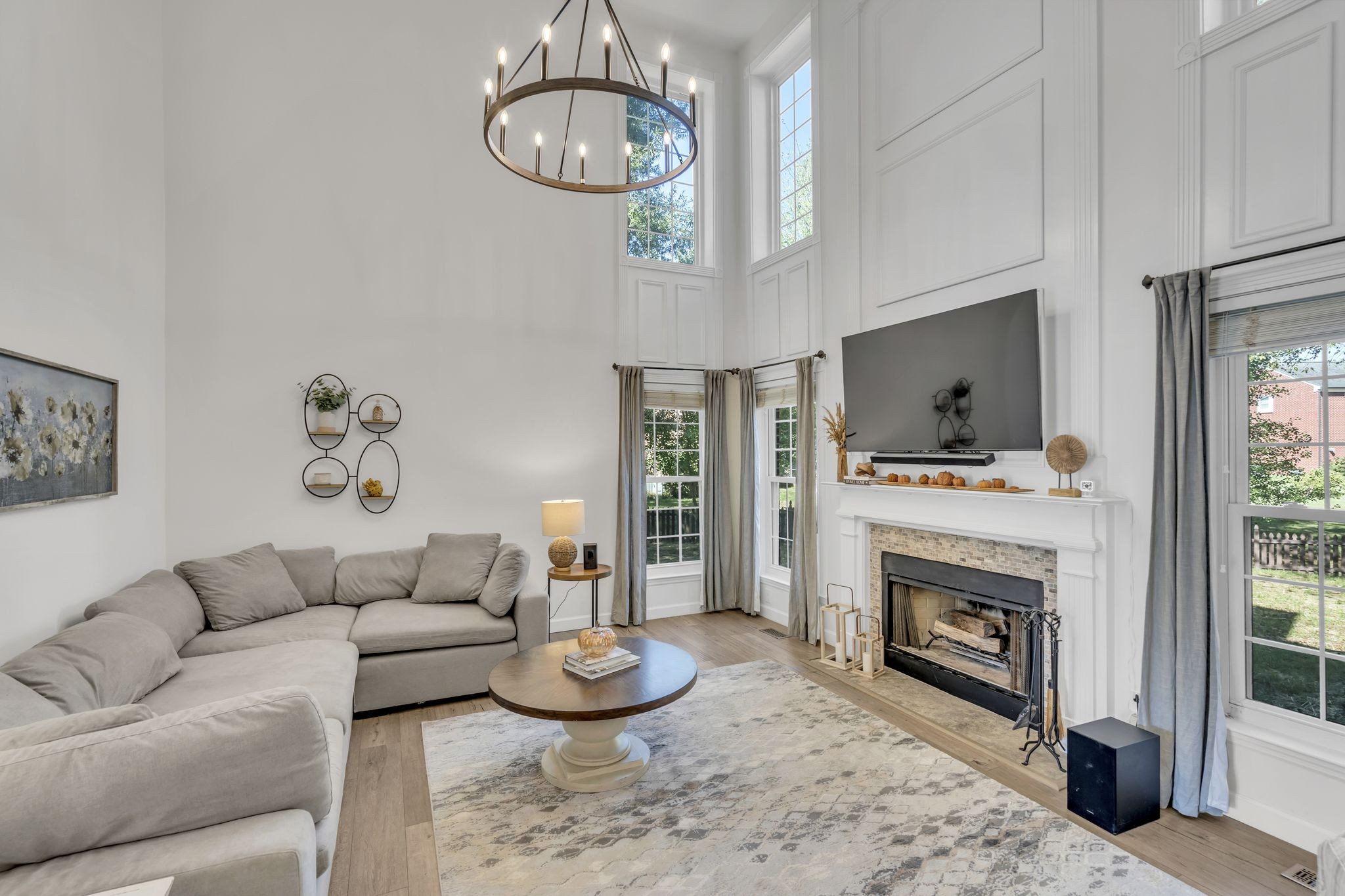 601 Rutherford Lane Franklin, TN 37064 - Photo 4 of 54 a living room with furniture a fireplace and a large mirror