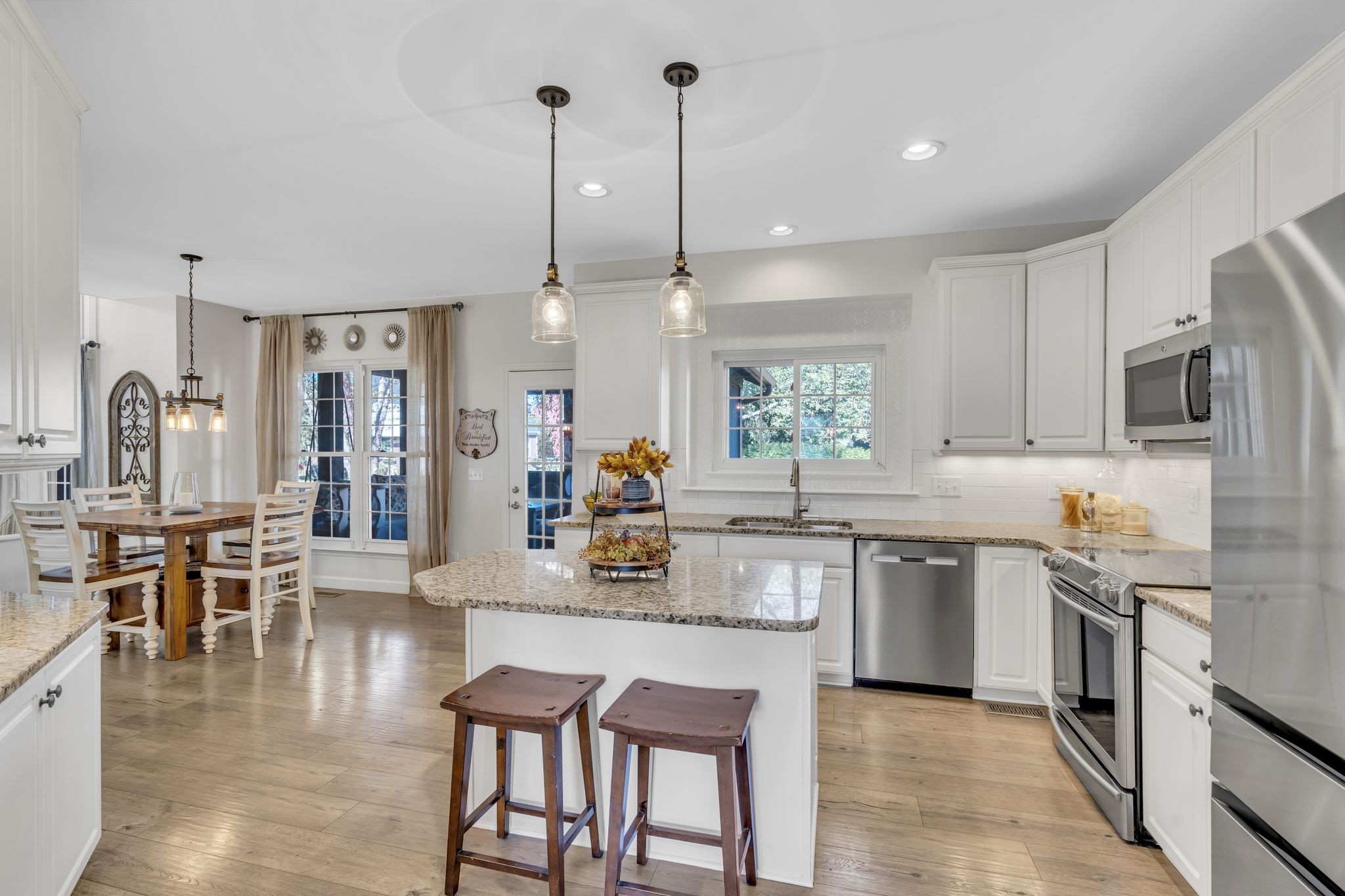 601 Rutherford Lane Franklin, TN 37064 - Photo 10 of 54 a kitchen with stainless steel appliances granite countertop sink stove top oven and cabinets