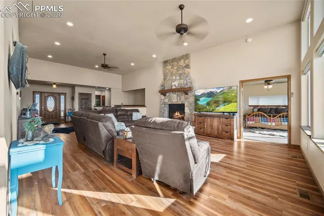 a living room with lots of furniture and a chandelier