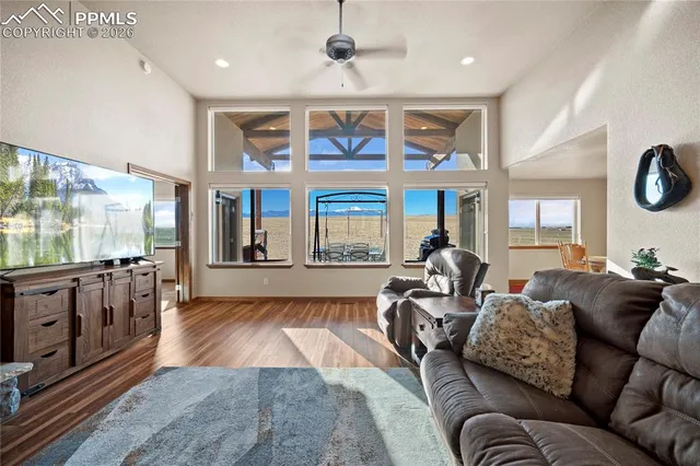 a living room with furniture fireplace and flat screen tv