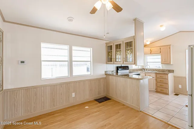 a kitchen with a stove a sink and dishwasher