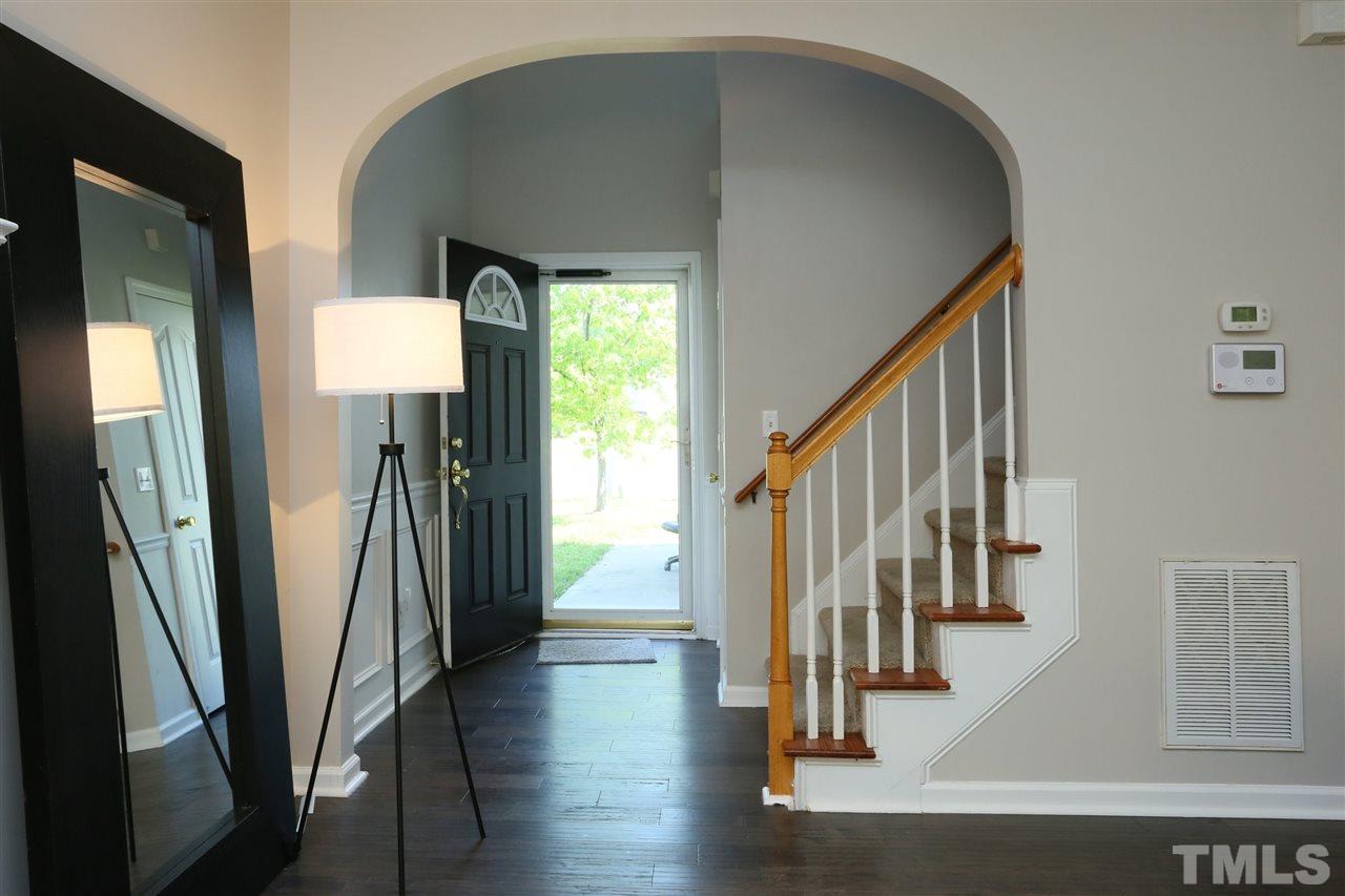 301 Burrell Road Durham, NC 27703 - Photo 2 of 30 a view of entryway with wooden floor and stairs
