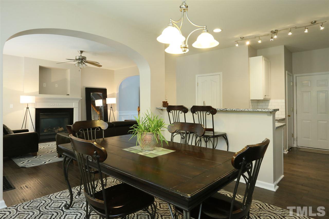 301 Burrell Road Durham, NC 27703 - Photo 11 of 30 a view of a dining room with furniture and wooden floor
