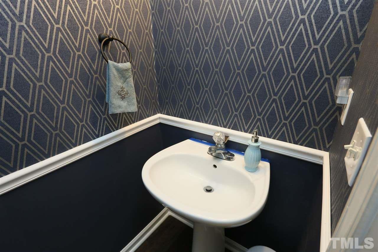 301 Burrell Road Durham, NC 27703 - Photo 12 of 30 a bathroom with a sink and mirror