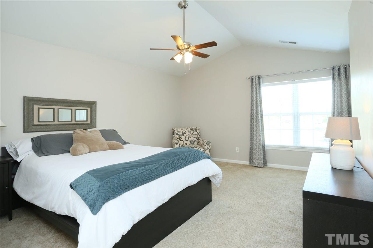 301 Burrell Road Durham, NC 27703 - Photo 13 of 30 a bedroom with a bed and window