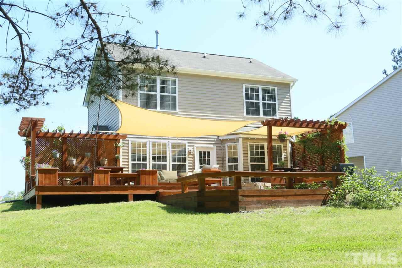 301 Burrell Road Durham, NC 27703 - Photo 21 of 30 a view of a house with backyard porch and sitting area