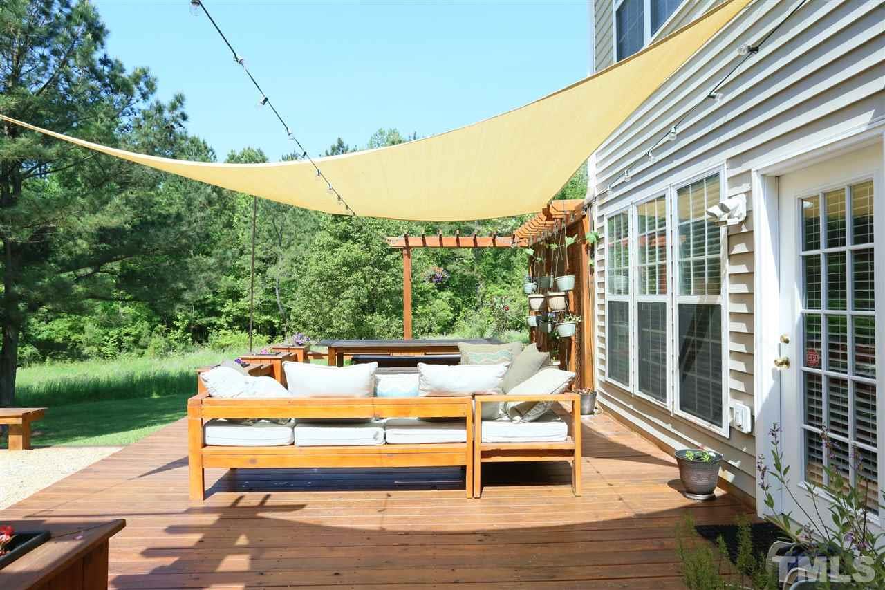 301 Burrell Road Durham, NC 27703 - Photo 23 of 30 a view of a patio with a table chairs and wooden fence