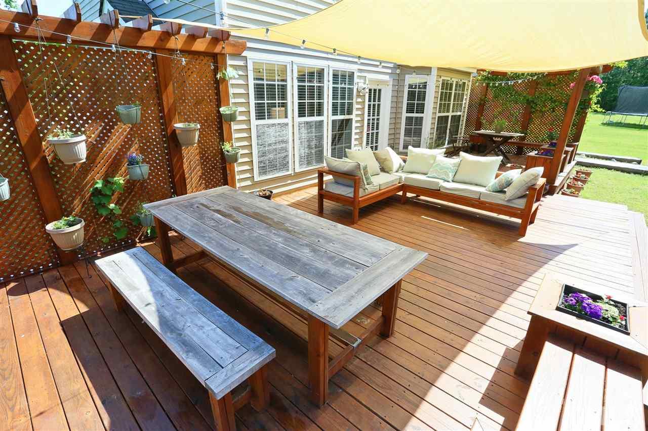 301 Burrell Road Durham, NC 27703 - Photo 24 of 30 a balcony with furniture and a table