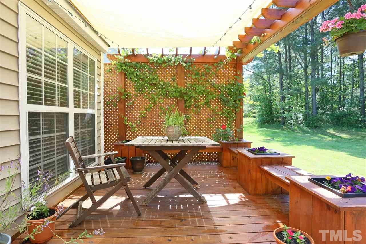 301 Burrell Road Durham, NC 27703 - Photo 26 of 30 a view of a patio with table and chairs and potted plants