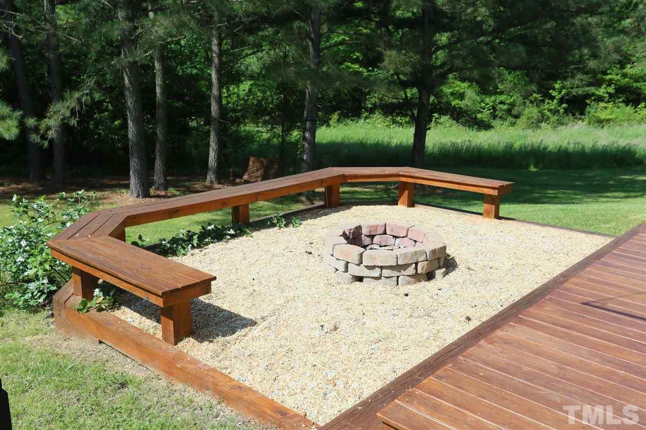 301 Burrell Road Durham, NC 27703 - Photo 27 of 30 a view of a backyard with sitting area