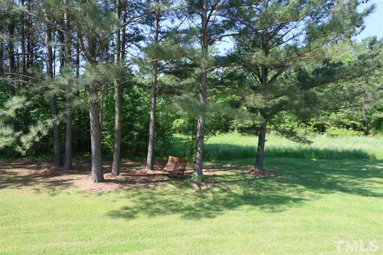 301 Burrell Road Durham, NC 27703 - Photo 29 of 30 a backyard of a house with lots of green space
