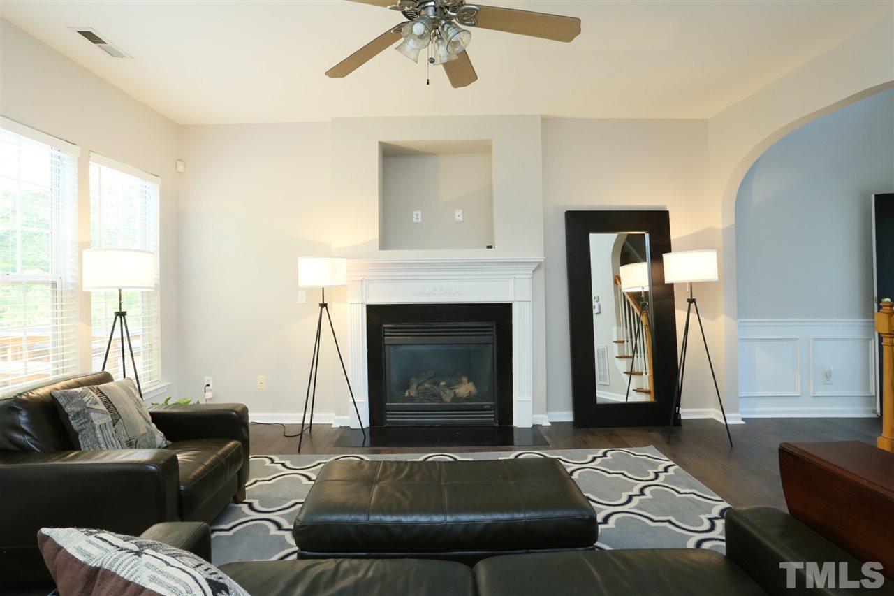 301 Burrell Road Durham, NC 27703 - Photo 4 of 30 a living room with furniture and a fireplace