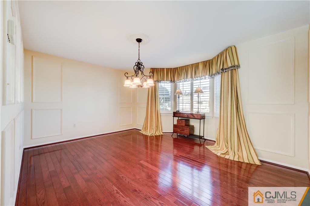 3 Old Road Monroe Township, NJ 08831 - Photo 11 of 25 a view of empty room with wooden floor and fan