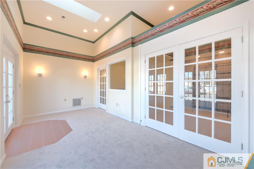 3 Old Road Monroe Township, NJ 08831 - Photo 13 of 25 a view of an empty room with a window and chandelier