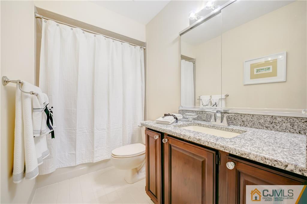 3 Old Road Monroe Township, NJ 08831 - Photo 21 of 25 a bathroom with a granite countertop sink and a mirror
