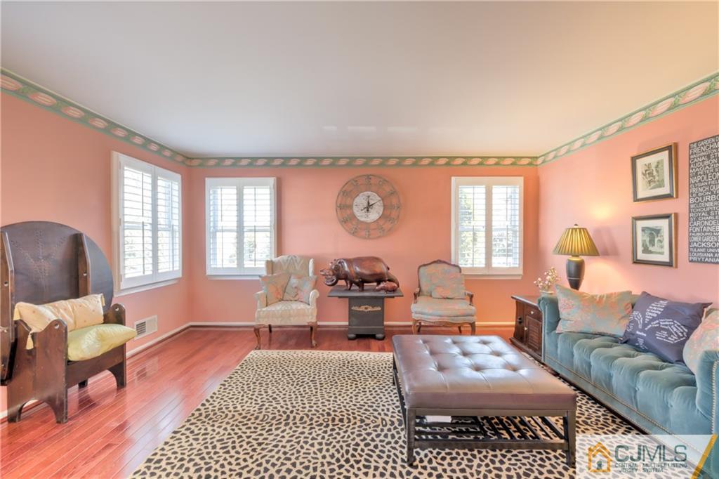 3 Old Road Monroe Township, NJ 08831 - Photo 4 of 25 a living room with furniture or couch and a wooden floor