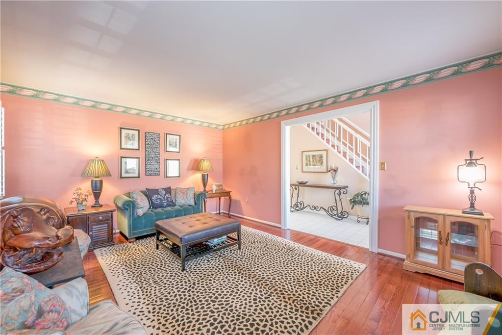 3 Old Road Monroe Township, NJ 08831 - Photo 5 of 25 a living room with furniture a rug and a table