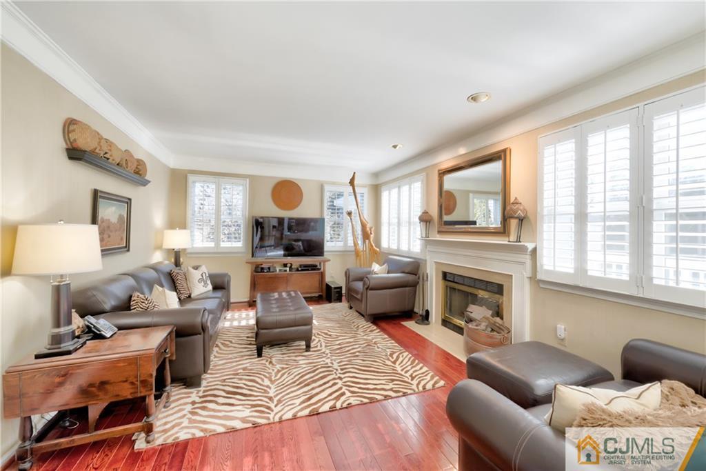 3 Old Road Monroe Township, NJ 08831 - Photo 6 of 25 a living room with furniture or couch and a fireplace