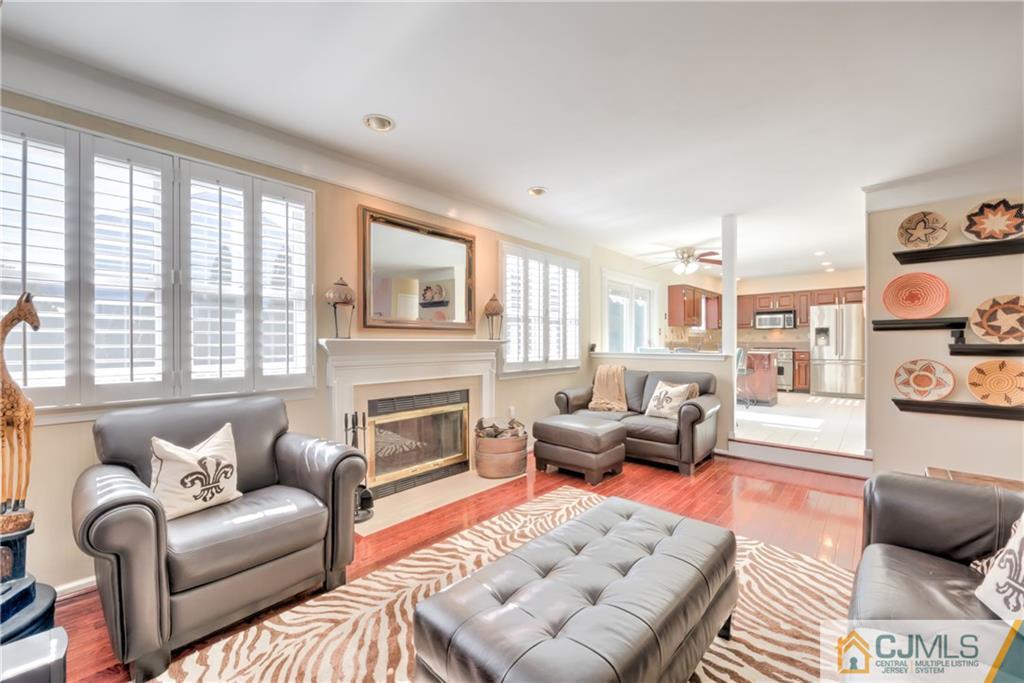 3 Old Road Monroe Township, NJ 08831 - Photo 7 of 25 a living room with furniture and a fireplace