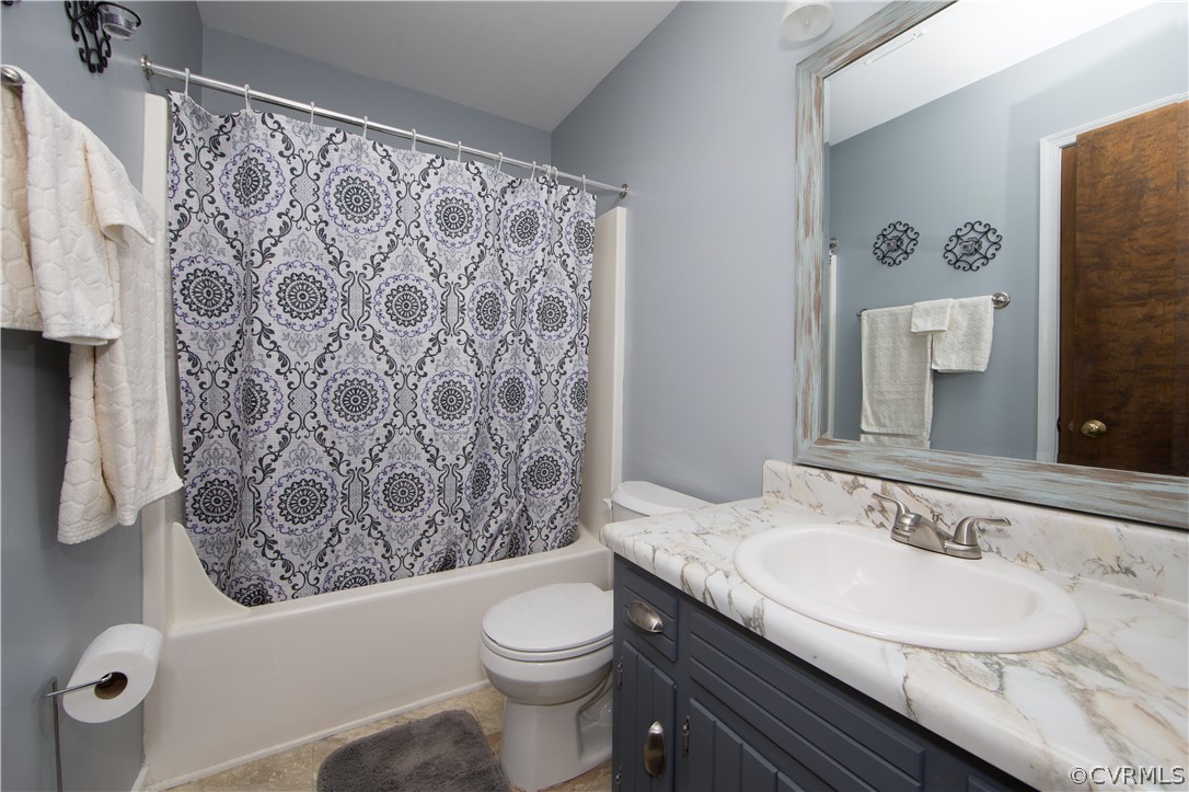 7760 Drexelbrook Road Chesterfield, VA 23832 - Photo 13 of 24 a bathroom with a granite countertop toilet sink and mirror