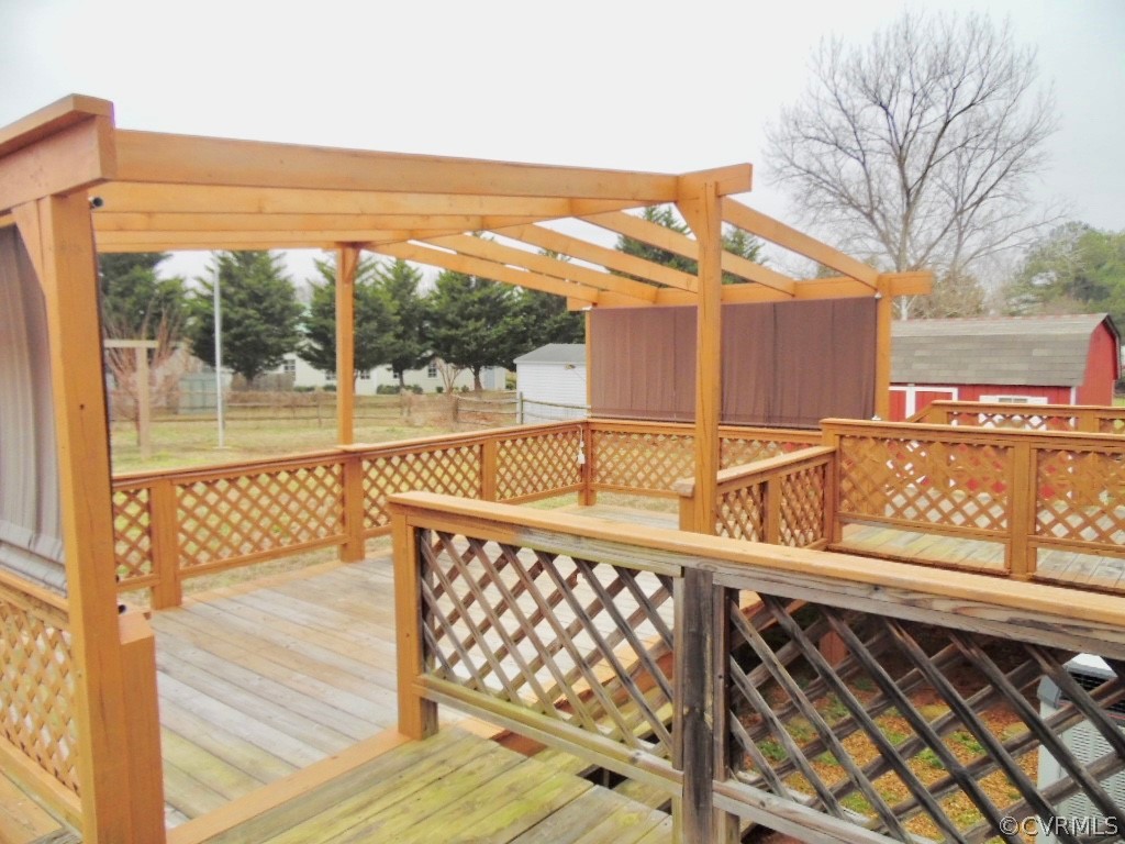 7760 Drexelbrook Road Chesterfield, VA 23832 - Photo 24 of 24 a view of a balcony with floor to ceiling windows wooden floor and outdoor space