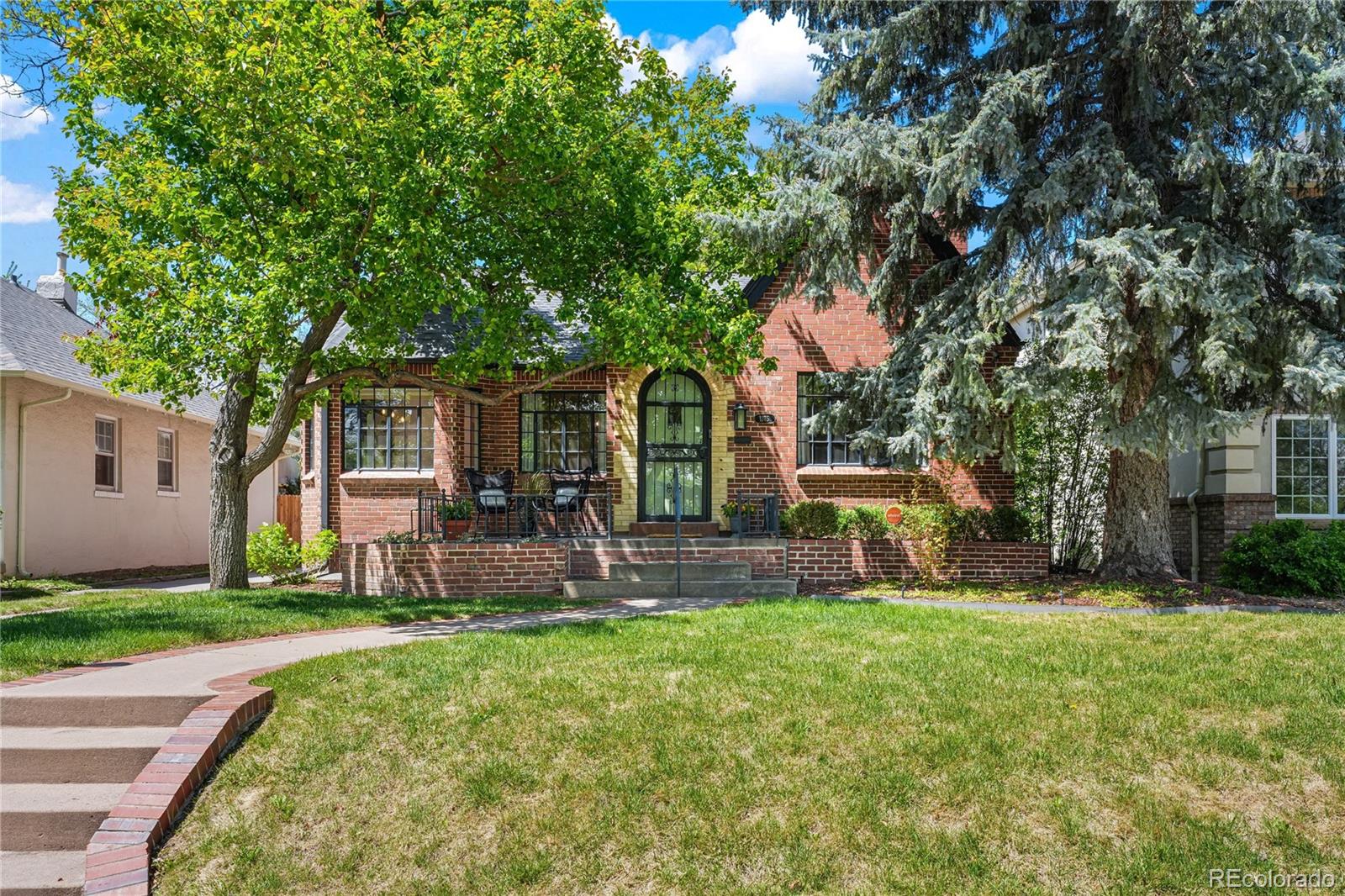 1375 Birch Street Denver, CO 80220 - Photo 1 of 27 front view of a house with a yard