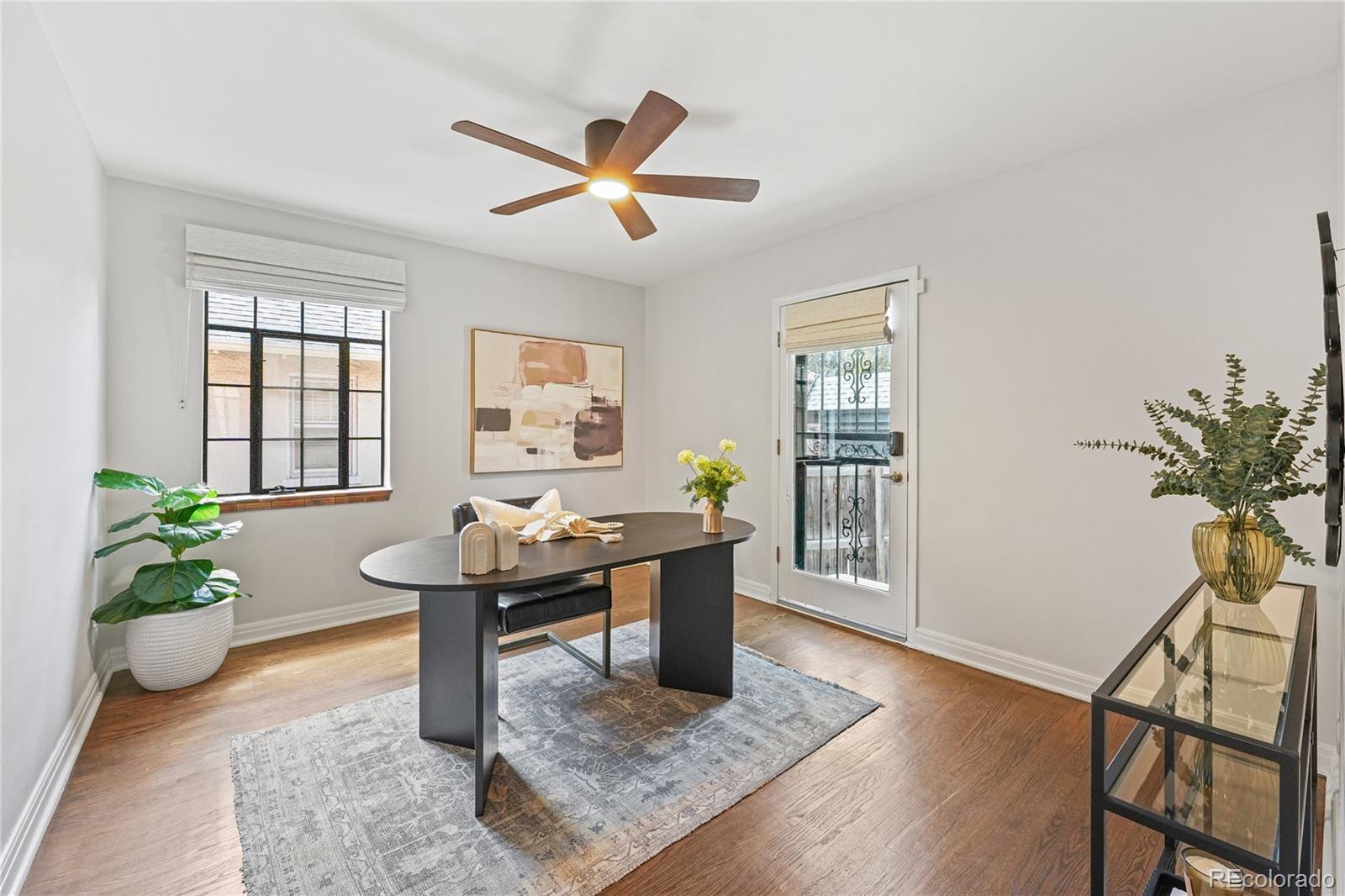 1375 Birch Street Denver, CO 80220 - Photo 13 of 27 a view of a workspace with furniture and a potted plant