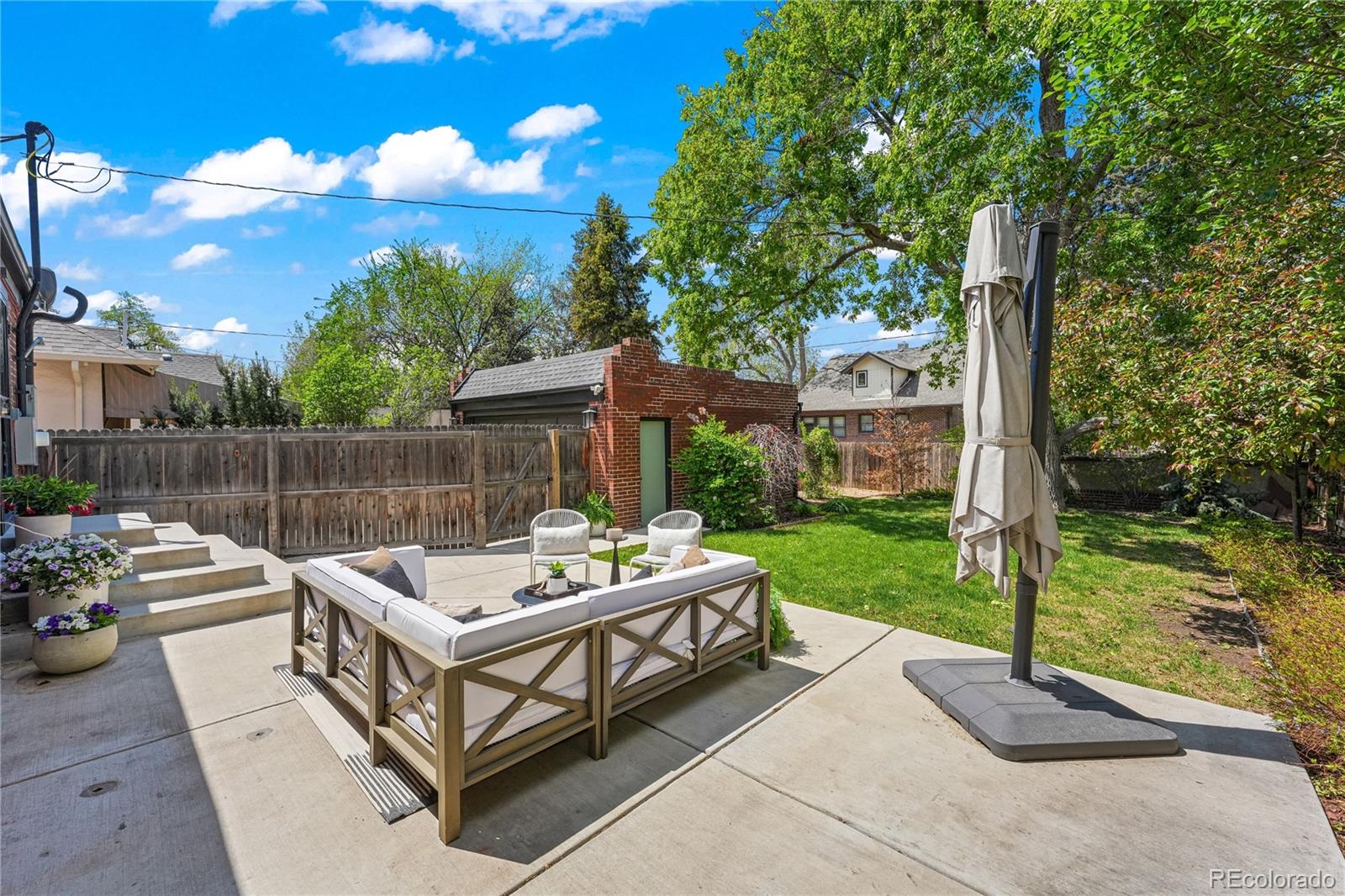1375 Birch Street Denver, CO 80220 - Photo 20 of 27 a view of a patio with a table and chairs