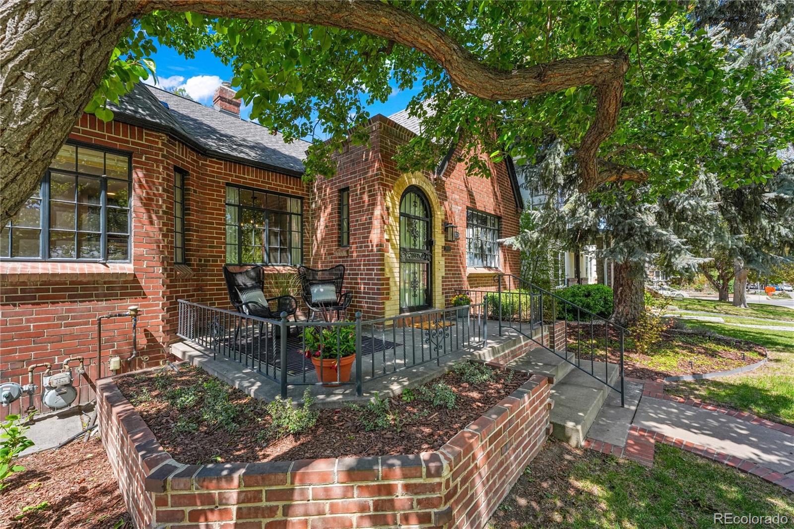 1375 Birch Street Denver, CO 80220 - Photo 2 of 27 a front view of house with a garden