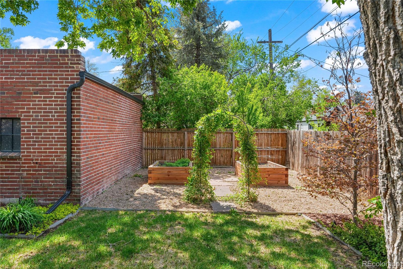 1375 Birch Street Denver, CO 80220 - Photo 21 of 27 a backyard of a house with lots of green space