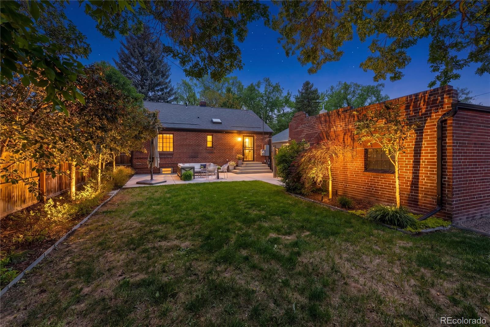 1375 Birch Street Denver, CO 80220 - Photo 22 of 27 a view of a house with a yard