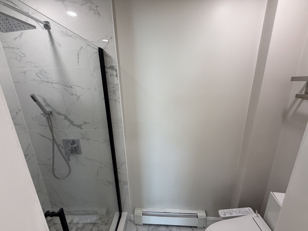 6 Channing Street, Unit 2 Newton, MA 02458 - Photo 11 of 17 a bathroom with a shower and toilet