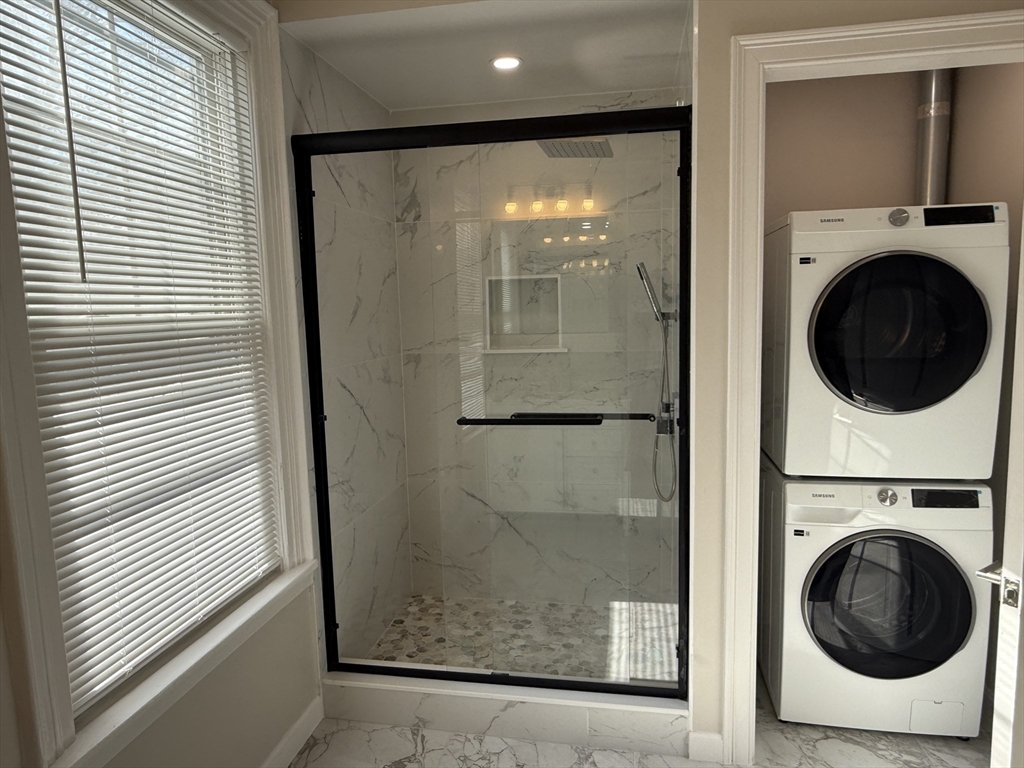 6 Channing Street, Unit 2 Newton, MA 02458 - Photo 17 of 17 a view of a hallway with washer and dryer