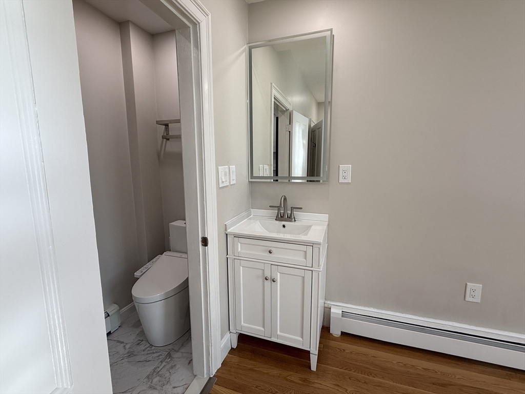 6 Channing Street, Unit 2 Newton, MA 02458 - Photo 10 of 17 a bathroom with a sink and a mirror