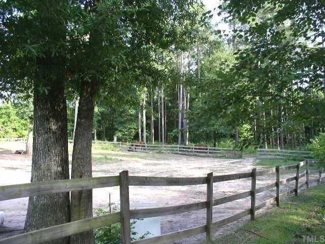 9265 Sauls Road Raleigh, NC 27603 - Photo 12 of 12 Note open gate at top right side of fence opens allows your horses to enter fenced in area under the trees.