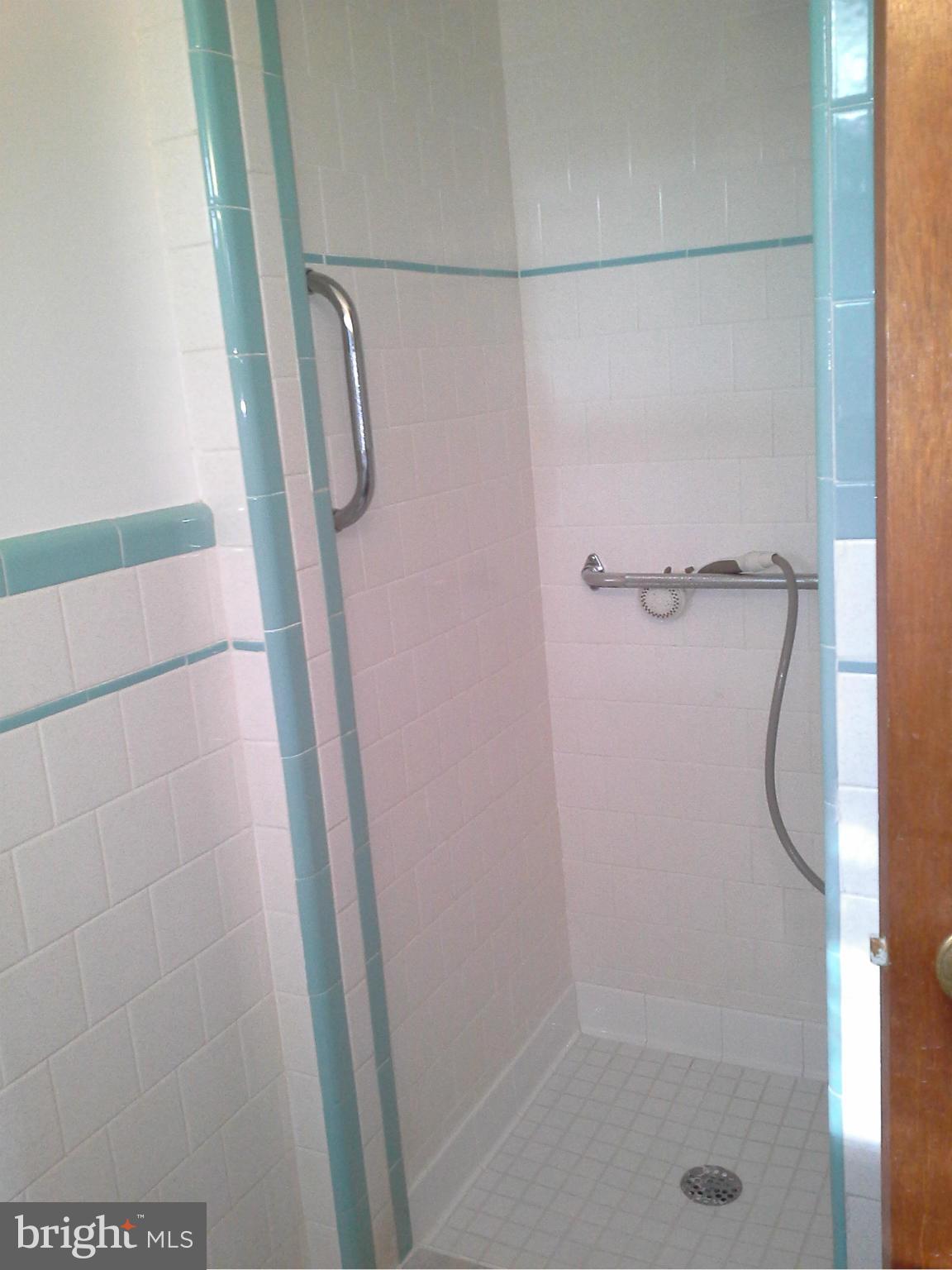 9912 Fox Hill Road Perry Hall, MD 21128 - Photo 17 of 26 a bathroom with a glass shower door