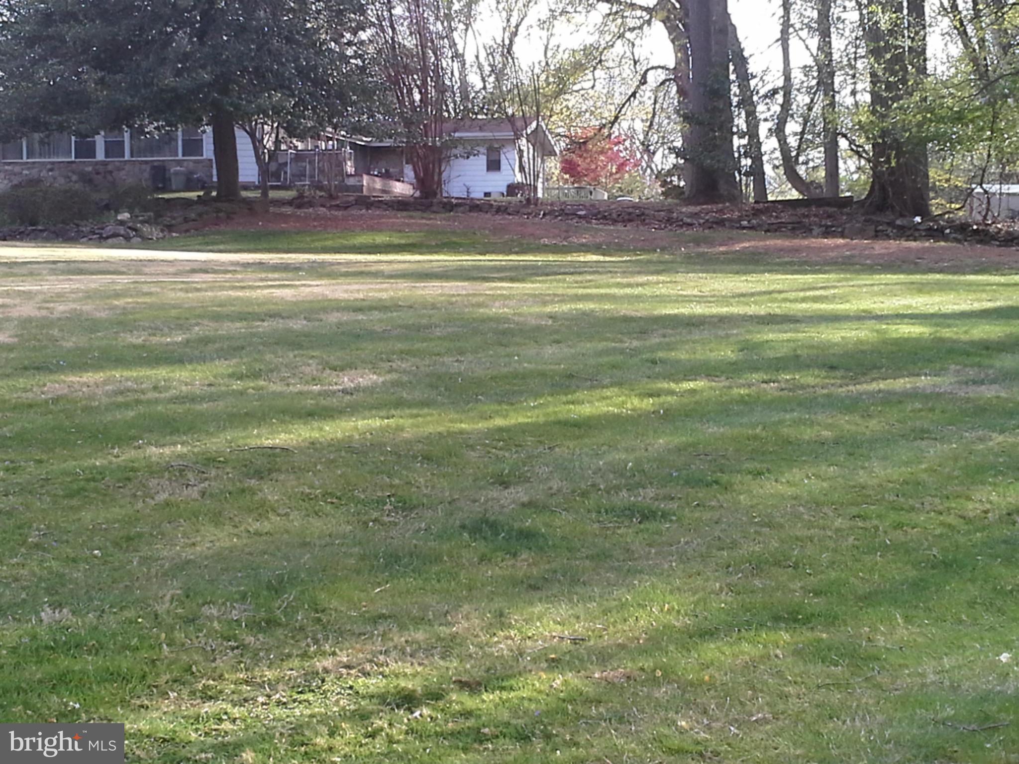 9912 Fox Hill Road Perry Hall, MD 21128 - Photo 5 of 26 a swimming pool view with large trees