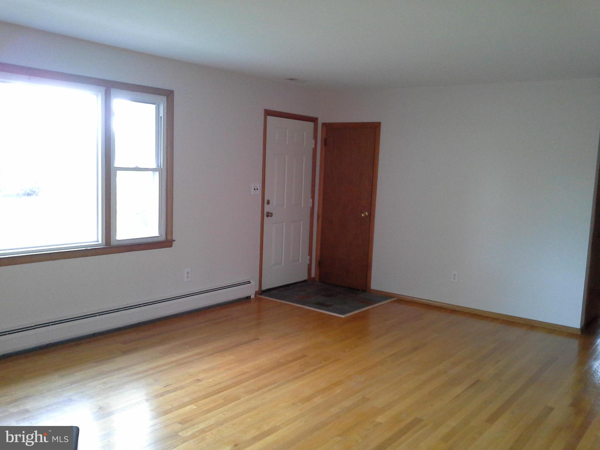 9912 Fox Hill Road Perry Hall, MD 21128 - Photo 10 of 26 an empty room with wooden floor and windows
