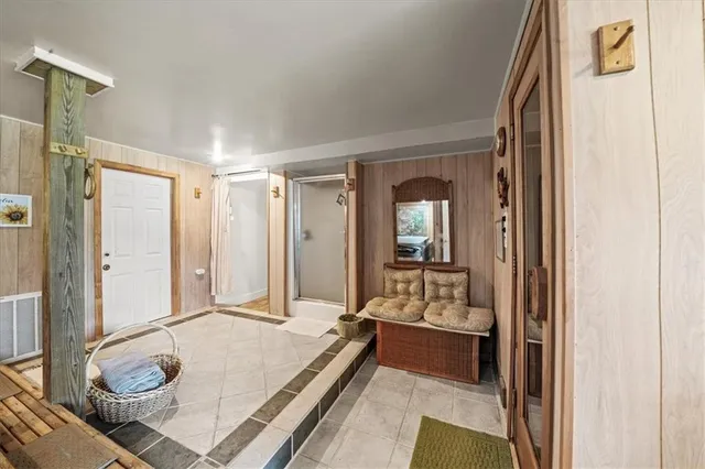 a view of entryway and hall with wooden floor