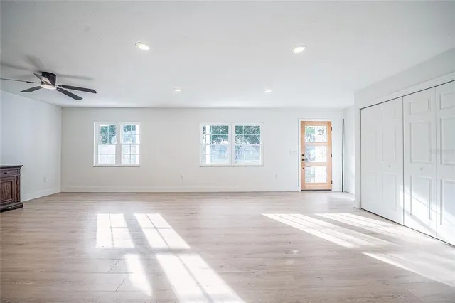 a view of livingroom with hardwood floor and a ceiling fan